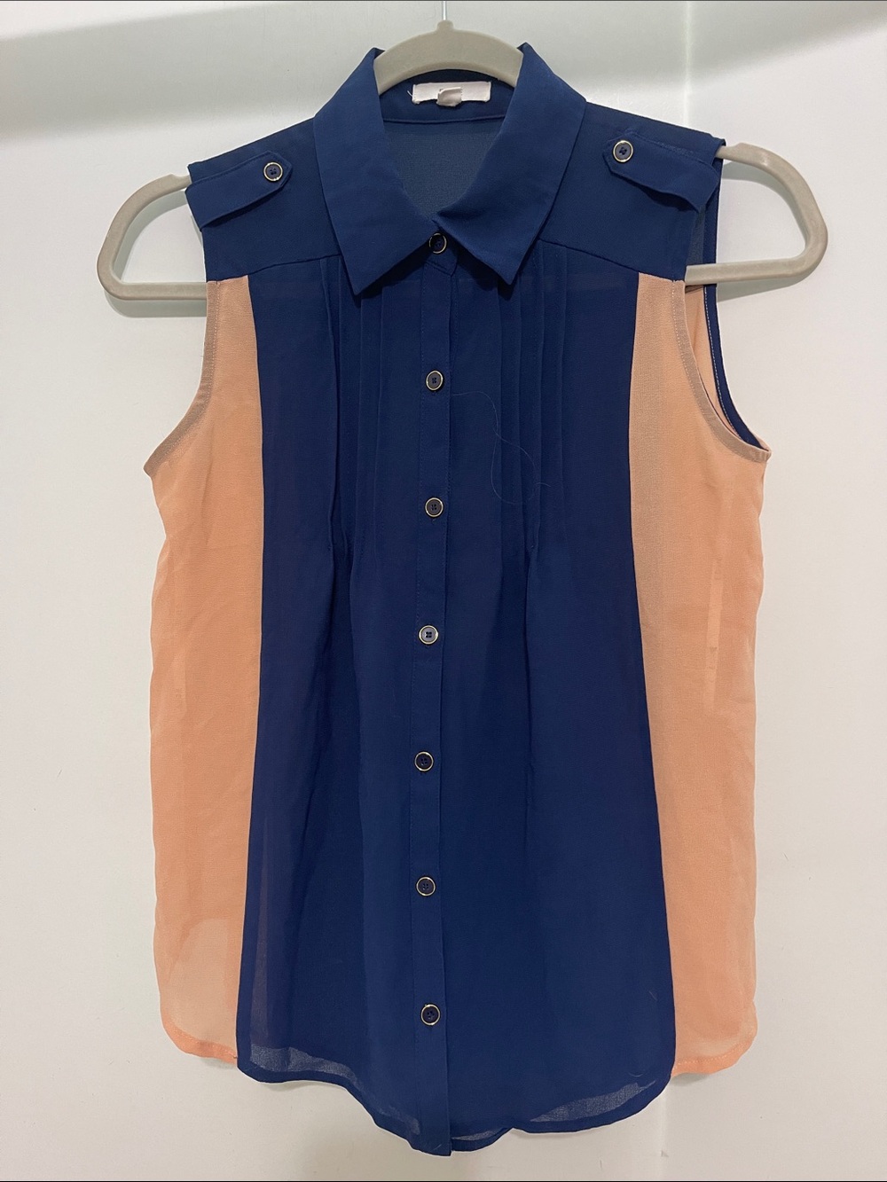 sleeveless blouse by EDGE.
Navy and light peach. Semi sheer.